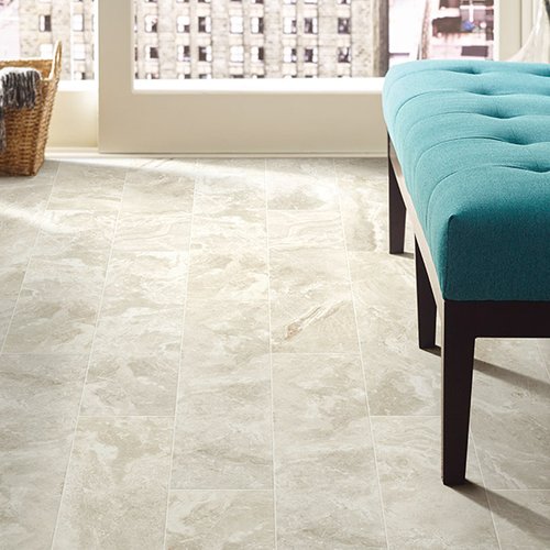 Blue sofa on tile floor from Prestige Flooring Center in Cathedral City, CA