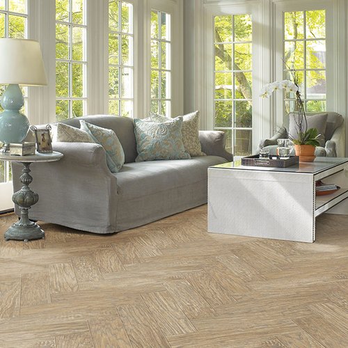 Grey sofa on laminate floor from Prestige Flooring Center in Cathedral City, CA